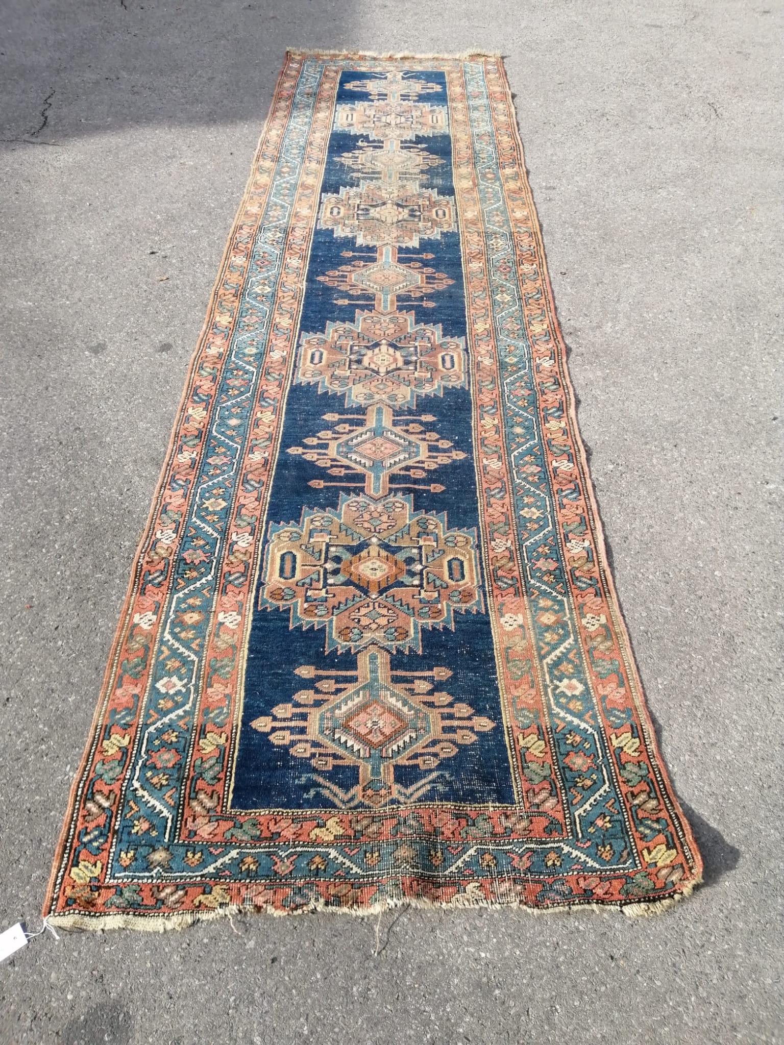 A North West Persian blue ground runner, (heavily worn) 404 x 101cm